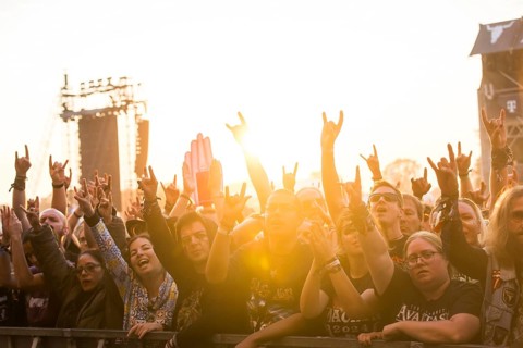 Festival-goers in the front row give the devil's salute at the Wacken Open Air in Wacken. The