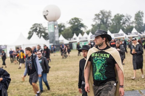 A festival visitor with Wacken shirt and cowboy hat at the Wacken Open Air in Wacken. The