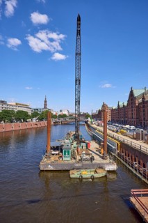 Crane on a pontoon in the inland harbour, construction site at the quay wall and Kehrwieder street,