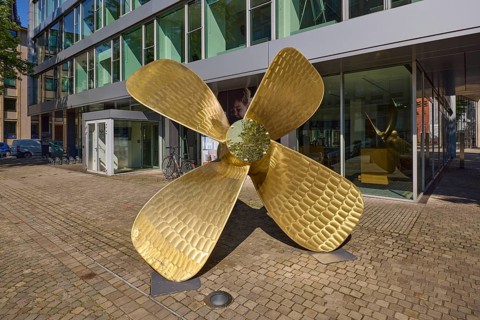Brass ship's propeller as decoration in front of the Regus office space rental building, Free and