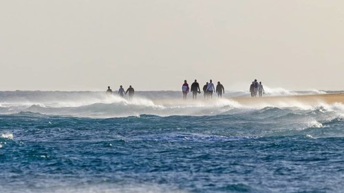 Destination Spain, swimming in the sea, travel, holidays, sun and fun on the beach, white sandy