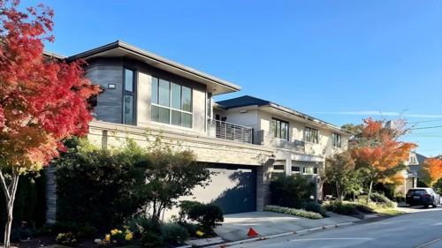 A serene suburban street featuring modern homes in autumn with colorful plants, AI generated