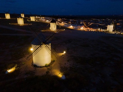 Illuminated windmills in a village at night, aerial view, windmills, Campo de Criptana, Ciudad Real