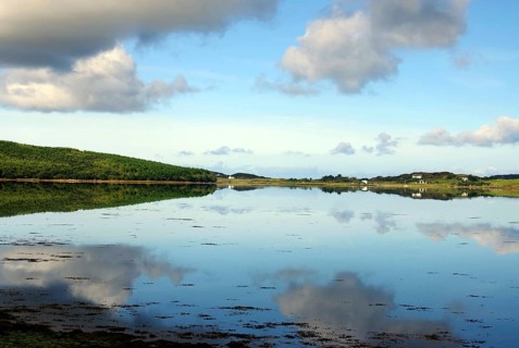 Calm lake with cloud reflections and green shores, silence, holiday, Letterfrack, Connemara