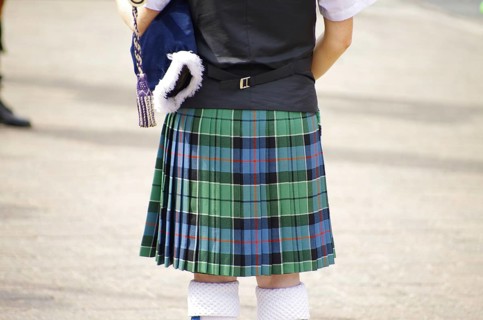 A person in a traditional Scottish kilt from behind, tradition, history, Scotland, Great Britain