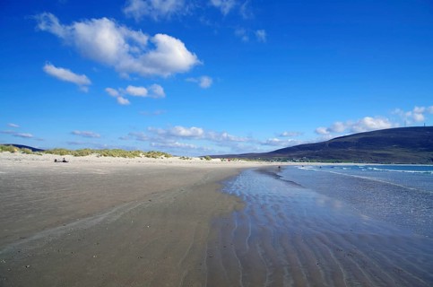 Empty sandy beach with shallow water and blue sky, Inch Bay, Dingle, Ireland, Europe