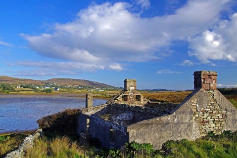 Stone ruins overlooking a bay and the sea, Achill Island, County Mayo, Ireland, Europe