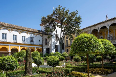 Garden with exotic plants, Casa de Pilatos city palace with Mudejar style elements, Seville,