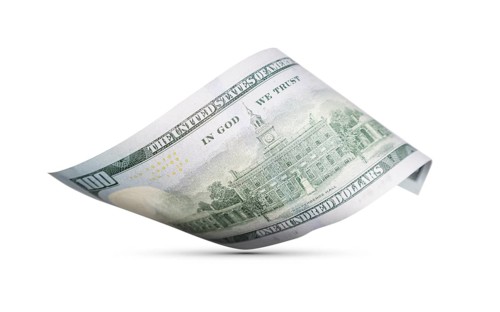 One hundred dollar bill floating down to surface with drop shadow isolated on a white background