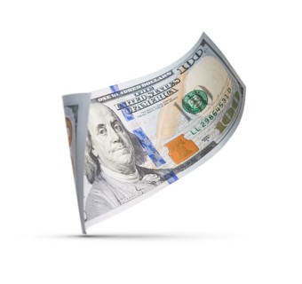 One hundred dollar bill floating down to surface with drop shadow isolated on a white background
