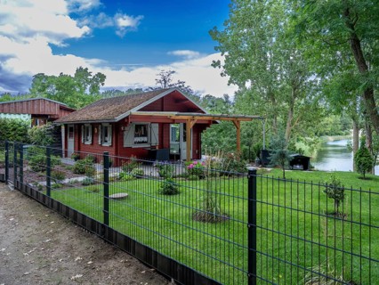 Fenced wooden holiday home with lawn on Lake Jersleben, Jersleben, Saxony-Anhalt, Germany, Europe