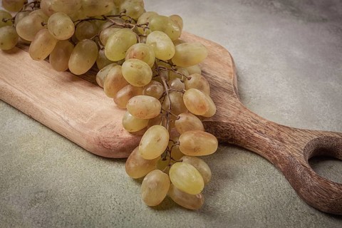 A branch of white grapes, wine grapes, Georgian grape variety Rkatsiteli, top view