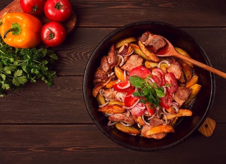 Ojakhuri, Traditional Georgian dish, fried potatoes with meat, in a clay frying pan, top view, no