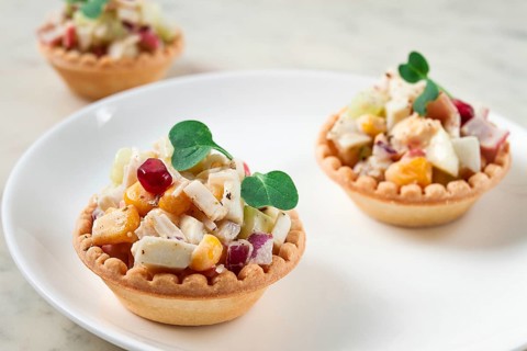 Canapes with salad, corn with crab sticks, appetizer, portioned, close-up, no people