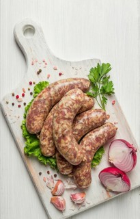 Raw kupaty, traditional Georgian sausages, raw sausages, with spices and herbs, Georgian cuisine