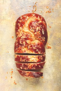 Braided, sweet bread pie, with sliced almonds, breakfast, braided bread, brioche, on a light
