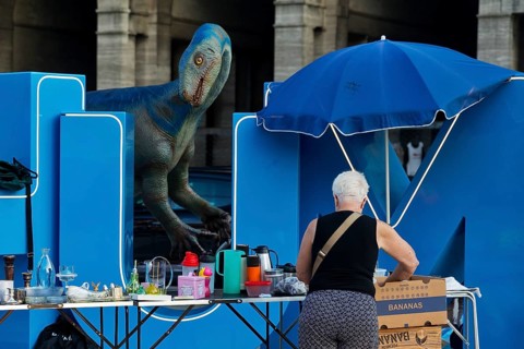 Plateosaurus model with flea market at the Bochum sign on the town hall square, Dino City III,