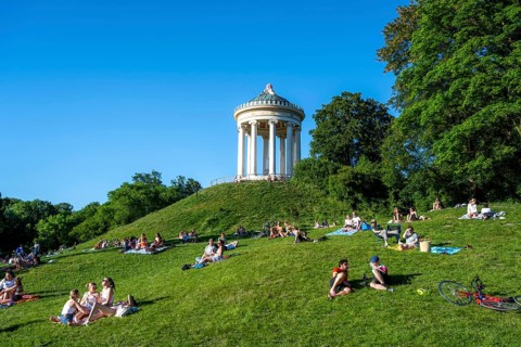 Monopteros in the English Garden, people enjoying the summer day in the park, Munich, Upper