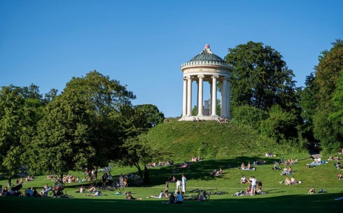 Monopteros in the English Garden, people enjoying the summer day in the park, Munich, Upper