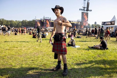 Festivalgoers in kilts at the Wacken Open Air in Wacken. The traditional metal festival takes place