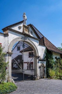 Lower entrance to Ittingen Charterhouse, a former Carthusian monastery with a statue of Bruno of