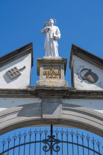 Statue of Bruno of Cologne, founder of the Carthusian Order, on the archway of the lower entrance
