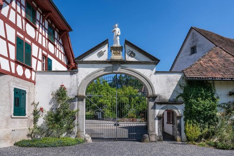 Lower entrance to Ittingen Charterhouse, a former Carthusian monastery with a statue of Bruno of