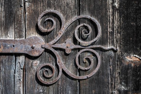 Old, hand-forged iron door fitting on a wooden gate, Ittingen Charterhouse, Warth-Weiningen near