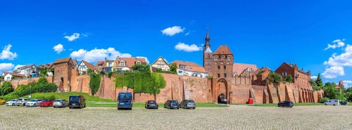 Town wall at the harbour with Elbe gate and tower of the Protestant church St. Stephan, panoramic