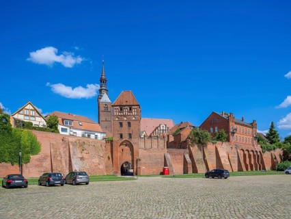 Town wall at the harbour with Elbe gate and tower of the Protestant church of St. Stephan,