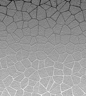 Abstract geometric pattern with textured gray shapes resembling a mosaic