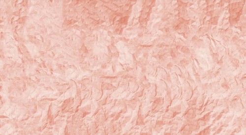 The image features a crumpled pink paper texture with a rough and wrinkled surface