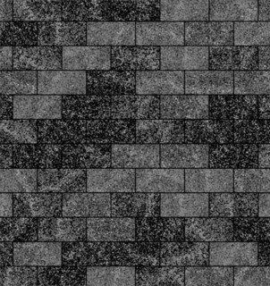 Rectangular brick pattern with a mix of grey and black shades, creating a rough, urban texture