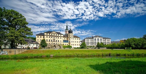 Classical Lower Castle and G. E. Lessing State School on the River Weisse Elster, residential town