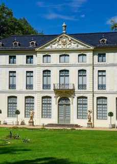 Main portal with two hunter figures, summer palace and park, residential town of Greiz, Thuringia,