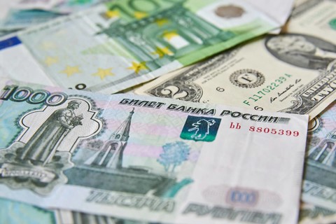 Background of paper bills dollars, euros and rubles. Currency exchange rate