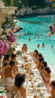 An elegant beach dinner party with a group of women seated around a table by a turquoise ocean, AI