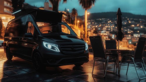 A van with its side door open parked on a wet street at night, city lights glowing in the