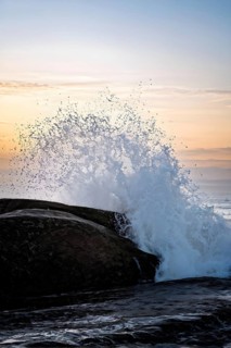 Ocean wave cresting with foam water glistening under sunlight, AI generated
