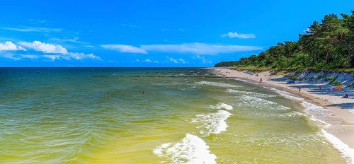 Sandy beach beach with clouds in the blue sky on the island of Usedom on the Baltic Sea, Zempin,