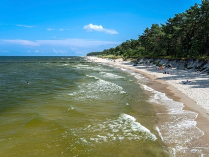 Sandy beach beach with clouds in the blue sky on the island of Usedom on the Baltic Sea, Zempin,