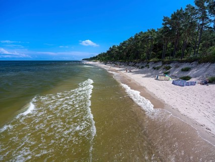 Sandy beach beach with clouds in the blue sky on the island of Usedom on the Baltic Sea, Zempin,