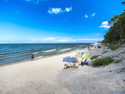 Sandy beach beach with clouds in the blue sky on the island of Usedom on the Baltic Sea, Zempin,