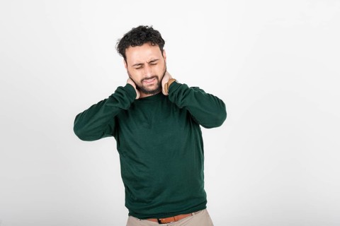 Young latin man with neck pain