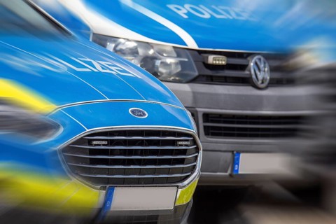 Symbolic image police operation: close-up of police emergency vehicles
