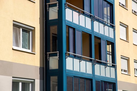 Living space extension through balcony glazing with sliding system