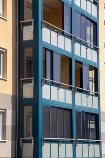 Living space extension through balcony glazing with sliding system