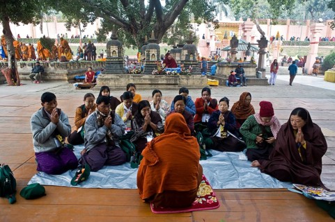 Buddhist monk teaching some buddhist principles to buddhist pilgrims from Myanmar (Mahabodhi temple