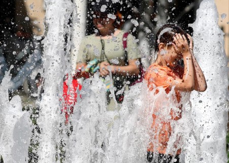 A boy cools off at a fountain, Berlin, 30.07.2024., Berlin, Berlin, Germany, Europe