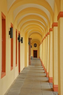 Yellow arcade from inside with archways and pillars, University, Lower Castle built 17th century,